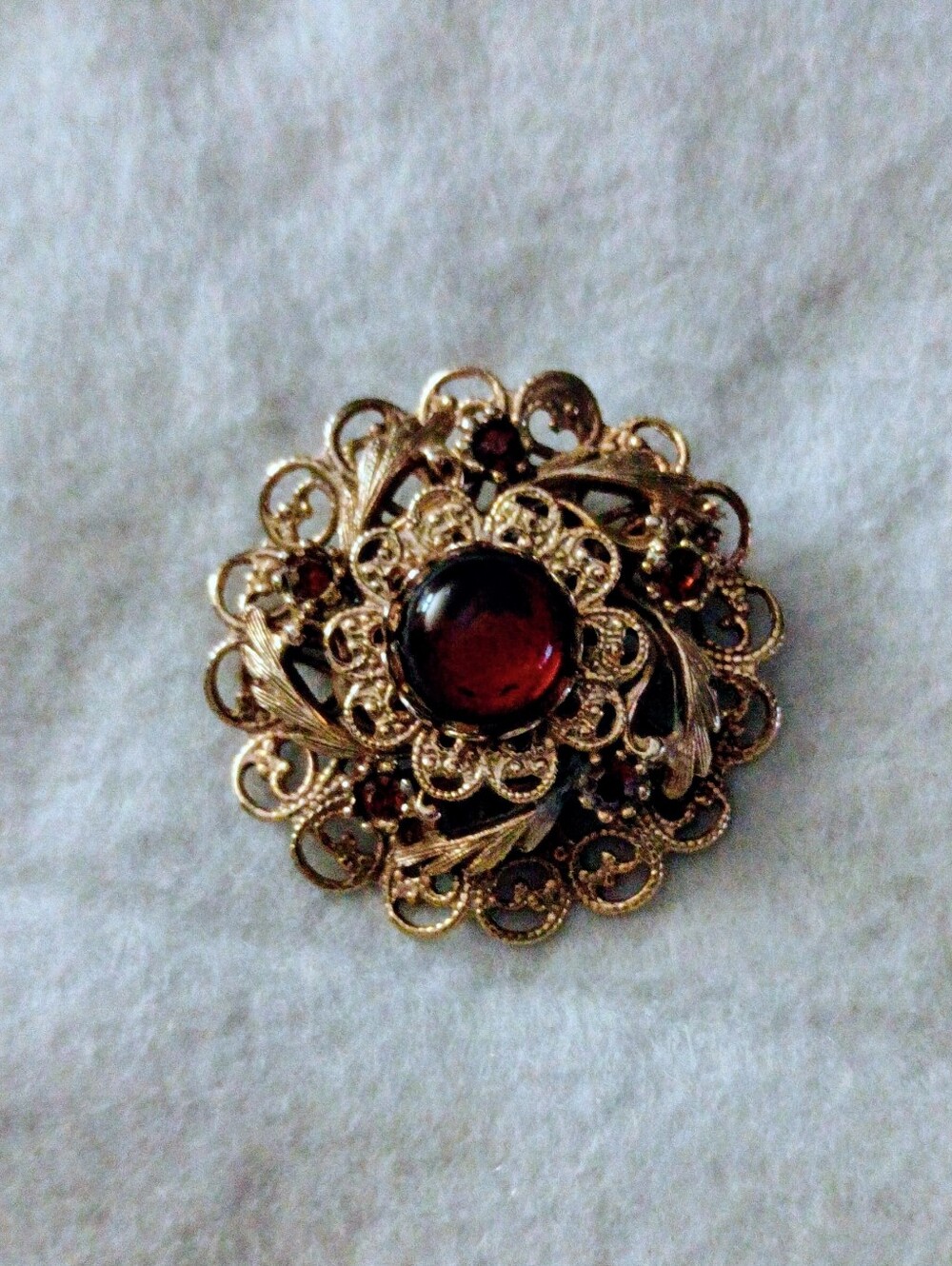 Vintage Gold Tone Filigree Floral Brooch Pin w/ Burgundy Center